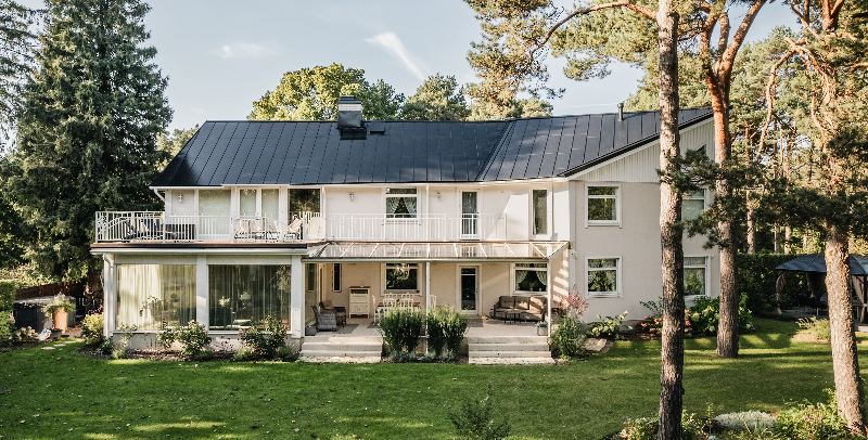 House with a dark integrated solar standing seam roof