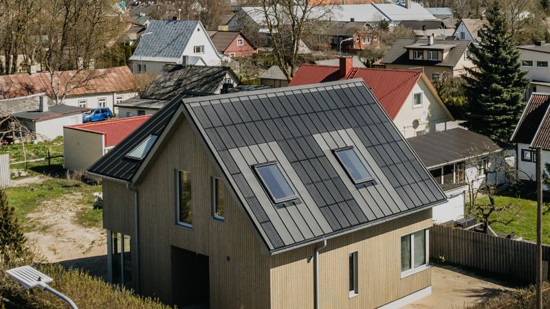 Aerial view of a house with an integrated standing-seam solar roof